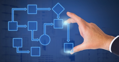 Digital composite of Hand touching wireframe with blue background
