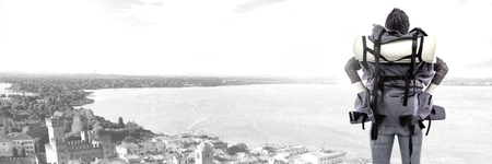 Digital composite of Travelling woman with bag in front of cityscape