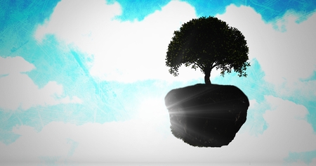 Digital composite of Floating tree in surreal skyの写真素材