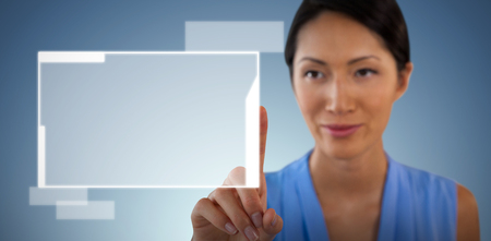 Close up of businesswoman touching interface against abstract blue backgroundの写真素材