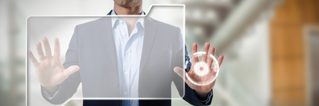 Businessman touching the invisible screen against modern stairs in office buildingの写真素材
