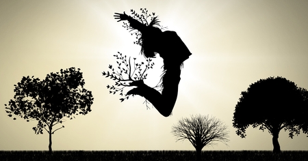 Digital composite of woman jumping expression with tree branchesの写真素材