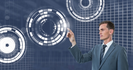 Digital composite of man touching circle interfaceの写真素材