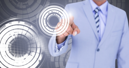 Digital composite of Man touching circle interfaceの写真素材