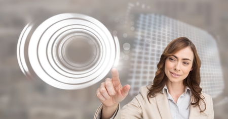 Digital composite of woman touching circle interfaceの写真素材