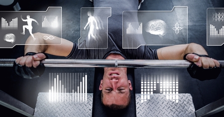 Digital composite of athletic fit man lifting weights in gym with health interfaceの写真素材