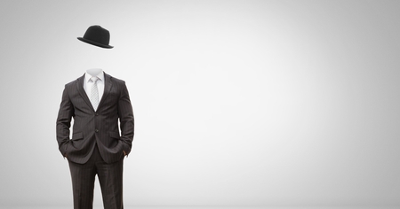 Digital composite of Headless man with surreal floating hatの写真素材