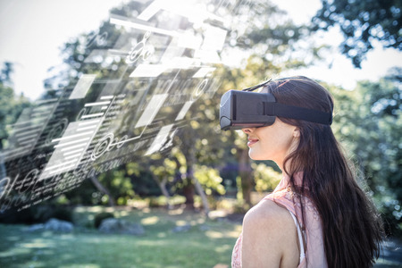 interface against woman using a vr 3D headset in the park