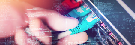 Image of data against technician plugging ethernet in a rack mounted serverの写真素材