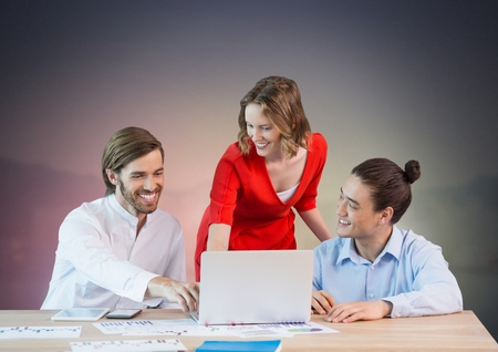 Digital composite of Business people working on laptopの写真素材