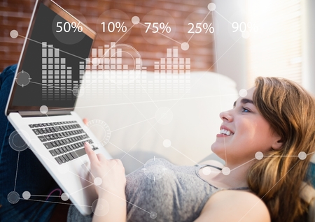 Digital composite of Business Overlay Interface with businesswoman and laptopの写真素材