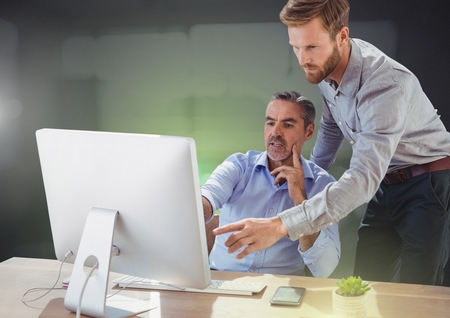 Digital composite of Business people working on computerの写真素材