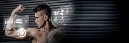 Digital composite of Athletic fit man flexing muscles in gym with health interfaceの写真素材