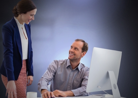Digital composite of Business couple working on computerの写真素材