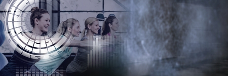 Digital composite of Athletic fit women in gym with health interfaceの写真素材