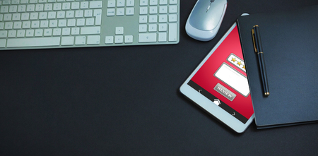 GPS against keyboard, mouse, digital tablet, pen and organizer on black backgroundの写真素材