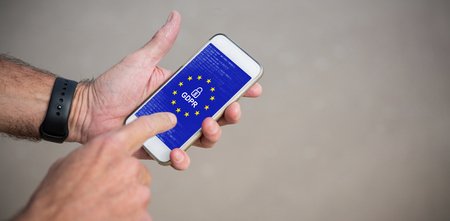 European Union locked against cropped image of man using phoneの写真素材