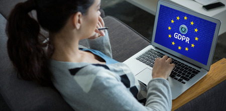 European Union locked against female business executive using laptop