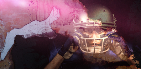 Rusty weathered wall against portrait of american football player wearing helmetの写真素材