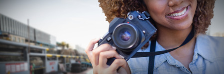 Headshot of smiling girl against construction siteの写真素材