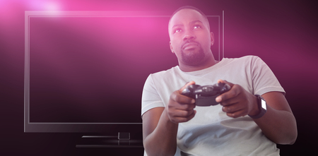 Man playing video game against white background against close-up of blank computer monitor