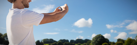 Man taking a selfie against green field
