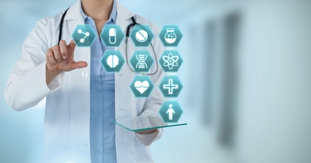 Digital composite of Doctor interacting with medical hexagon interface
