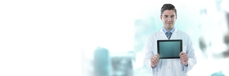 Digital composite of Male doctor holding tabletの写真素材