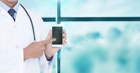 Digital composite of Doctor holding tabletの写真素材