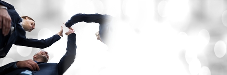 Digital composite of Teamwork transition with business people joining hands