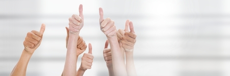 Digital composite of Teamwork transition with thumbs up hands groupの写真素材