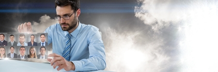 Digital composite of Man touching portrait profiles of different peopleの写真素材