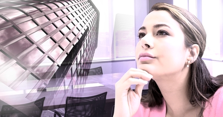 Digital composite of Tall building and woman thinking in office meeting roomの写真素材