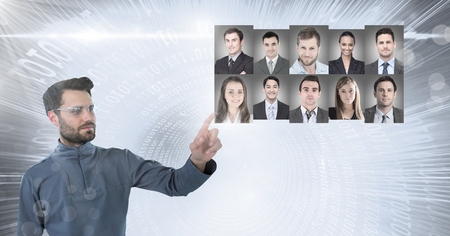 Digital composite of Man touching portrait profiles of different peopleの写真素材