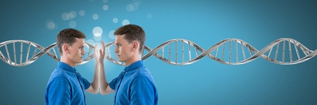 Digital composite of Clone twin man touching himself with genetic DNA and sparklesの写真素材