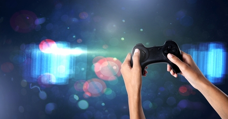 Digital composite of Hands holding gaming controller