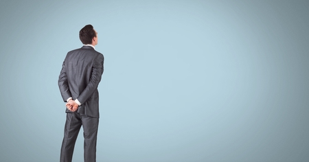 Digital composite of Businessman standing proudly with back facingの写真素材