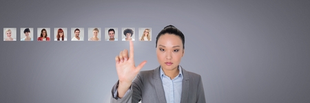 Digital composite of Woman touching portrait profiles of different peopleの写真素材