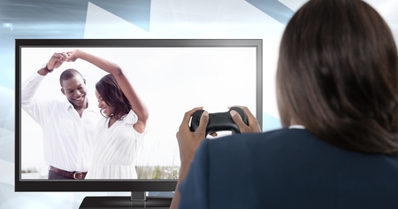 Digital composite of Woman playing ideal romance computer game with controller in handsの写真素材