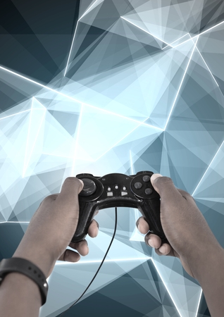 Digital composite of Hands holding gaming controllerの写真素材