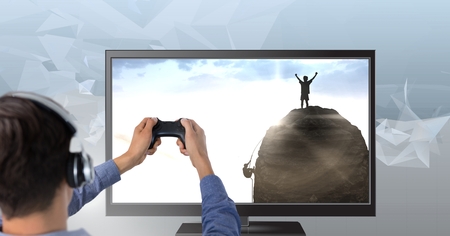 Digital composite of Hands holding gaming controller  with climbers on televisionの写真素材