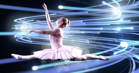 Digital composite of Ballet dancer dancing with curving lines of light glowingの写真素材