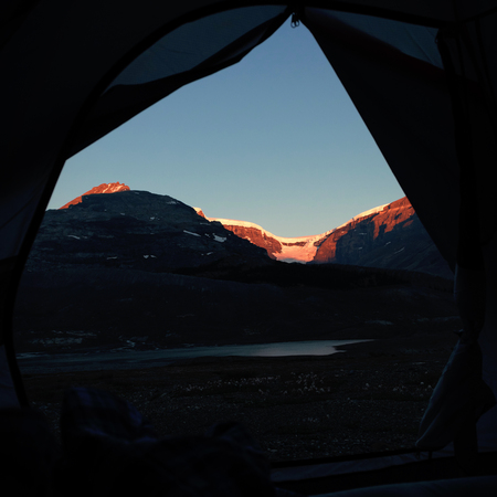 Beautiful snow capped mountain on a sunny dayの写真素材