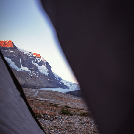 Beautiful snow capped mountain on a sunny dayの写真素材