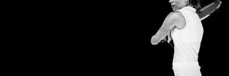 Athlete playing tennis with a racket on white backgroundの写真素材