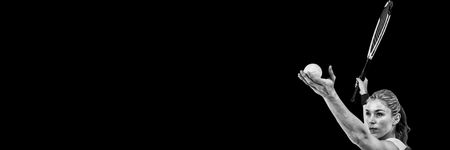 Athlete holding a tennis racquet ready to serve on white backgroundの写真素材