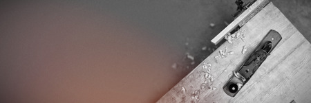 Jack plane with piece of wood on a table at workshopの写真素材