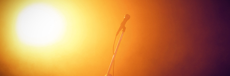 Microphone in illuminated nightclubの写真素材