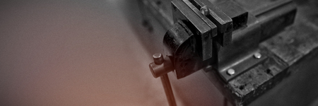 Vise tool on a wooden table at solar stationの写真素材