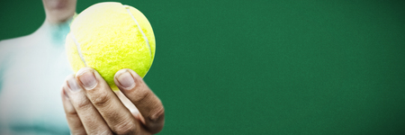 Tennis woman against green backgroundの写真素材